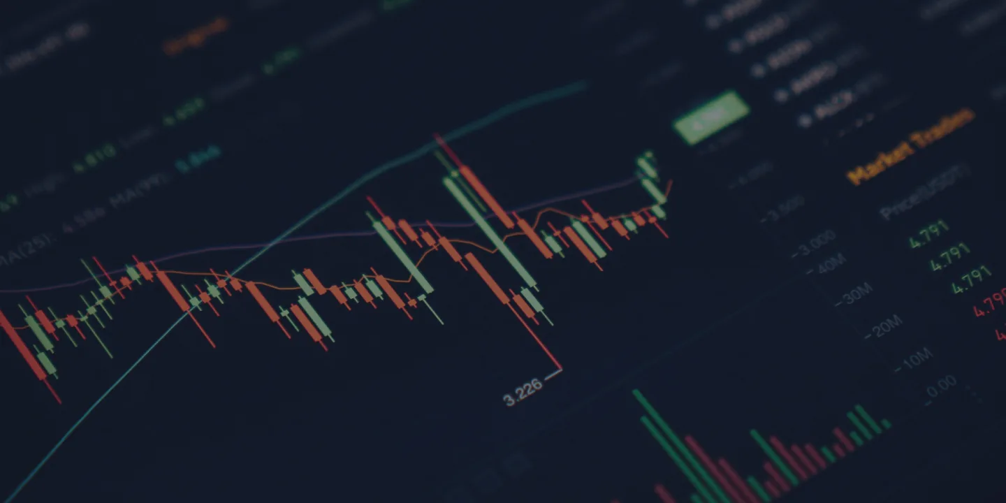 Candlestick chart with red and green bars showing crypto price movements on dark background