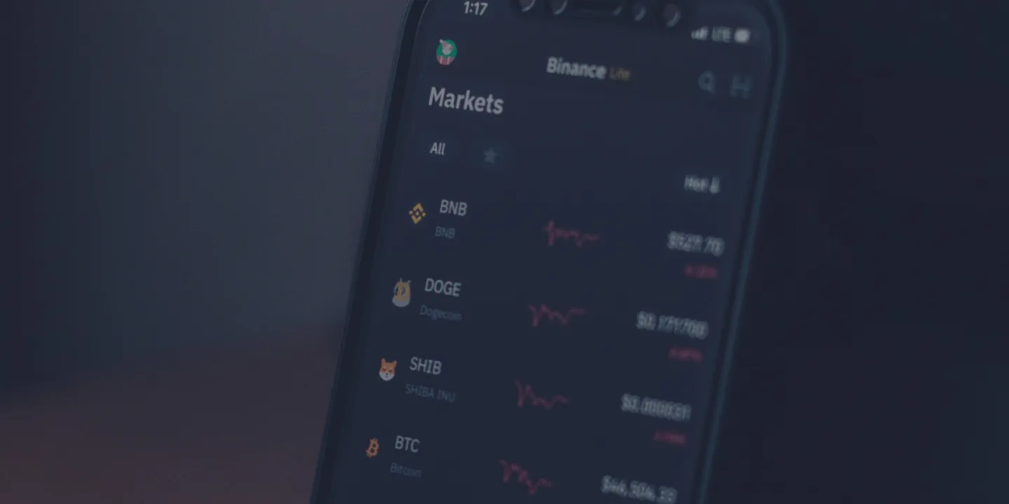 Smartphone displaying Binance Markets cryptocurrency listings