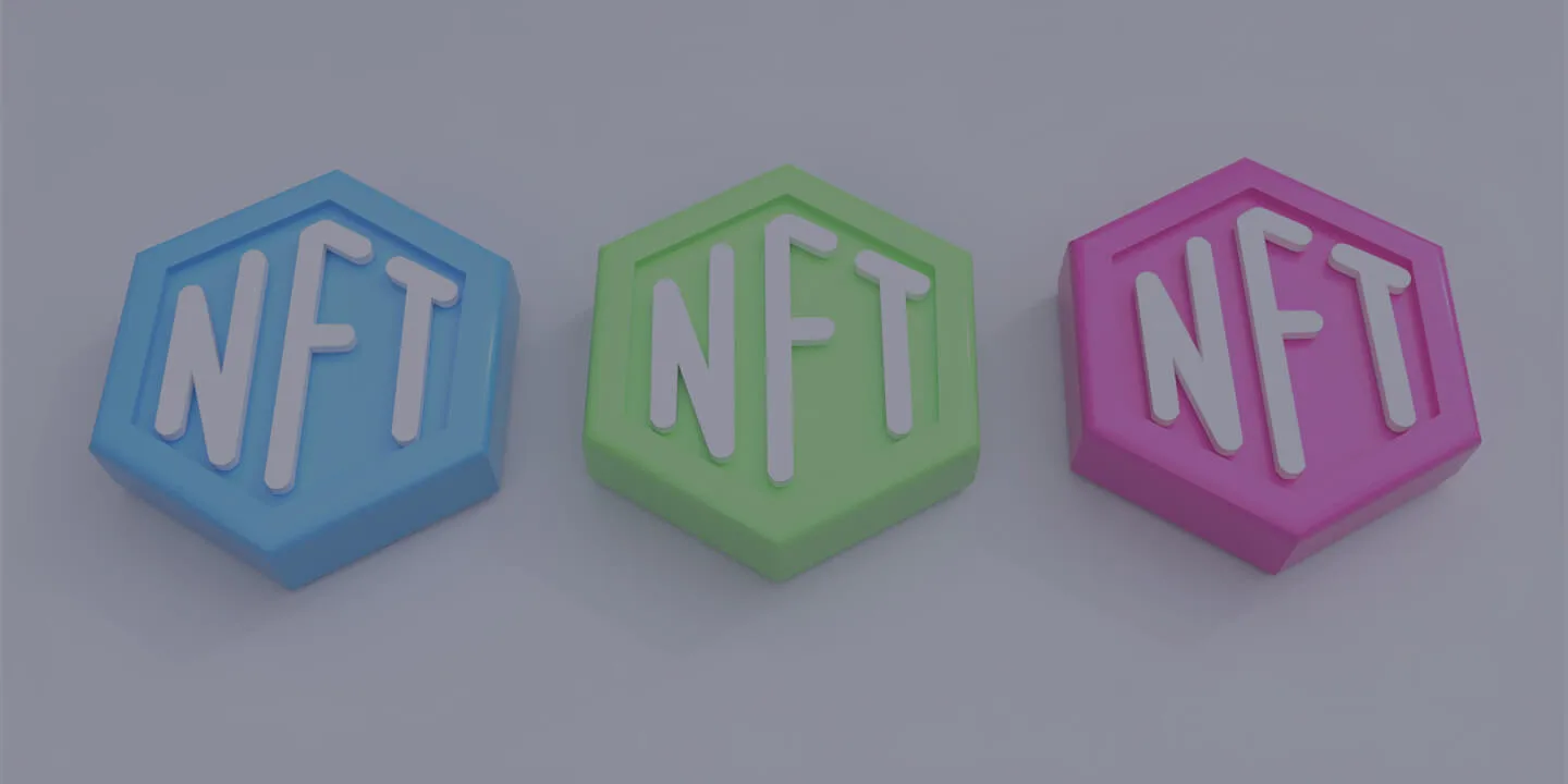 Three hexagonal 3D blocks labeled NFT in blue, green, and magenta