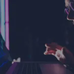 Professional analyzing financial trading charts on monitor at night