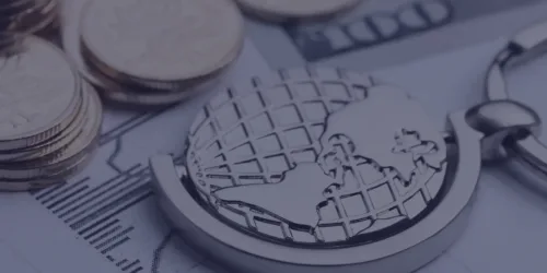 Coins and globe showing international tax jurisdictions