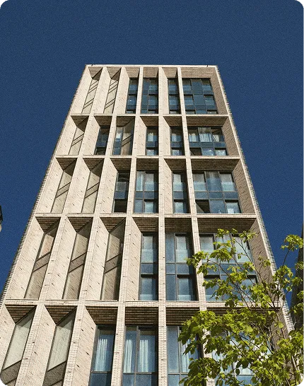 Modern office building with brick facade and geometric window pattern