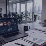 Modern office desk with laptop and gaming analytics dashboard